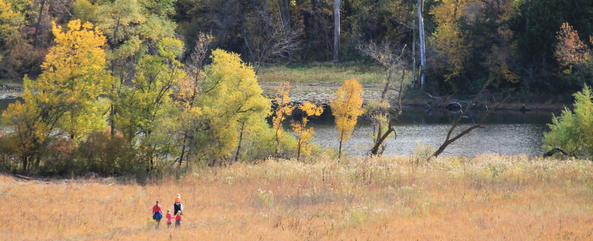 hikers along trail at Hitchcock Nature Center