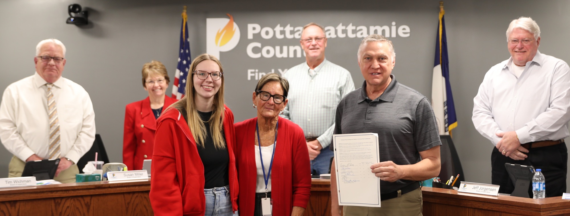 Prevention Specialists from Heartland Family Services with Board of Supervisors and signed proclamation